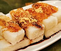 Sichuanese deep-fried ciba served with brown sugar syrup and roasted soybean flour. Ciba cake 2.jpg