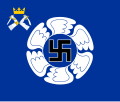 The colour of the Karelian Air Command features, like all Finnish Air Force colours, a swastika within a winged circle. The identifying device is a small coat of arms of Karelia