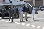 President Trump and first lady Melania walk through a neighborhood in Guaynabo.