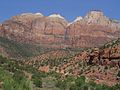 Bee Hive Peak (left) with The Streaked Wall featured. Note the white Navajo Sandstone of the beehive shaped summit. The peak to right is The Sentinel.