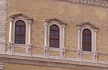 Open pediments on windows at the Palazzo Farnese, Rome, by Antonio da Sangallo the Younger, begun 1534 Palazzo Farnese Roma (cropped).JPG