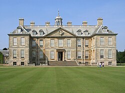 Belton House. Externally the windows of the servant's semi-basement are visible at ground level. Internally they are too close to the ceiling to have a view. Belton House 2006.jpg