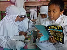 Boys and girls students are studying together in their classroom. Bangunan 7.jpg