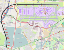 A map of the Heathrow airport area, with a curved solid black line starting from the northern runway and ending southwest of the airfield; red numbers from 0 to 150 are marked along the black line.