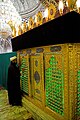 A mollah praying on seyyed Hamza tomb. Imamzadeh-ye Seyyed Hamza, Tabriz, Iran.