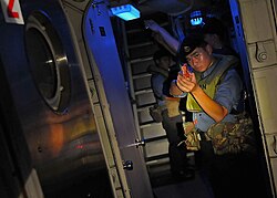 A Royal Brunei Navy sailor watch as passageway aboard USCGC Mellon (WHEC-717) during CARAT 2010.