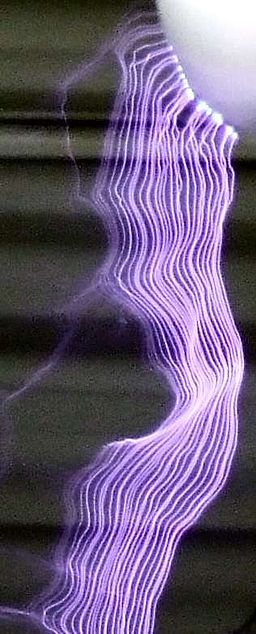 Electric discharge showing the ribbon-like plasma filaments from multiple discharges from a Tesla coil. Electrostatic-discharge.jpg