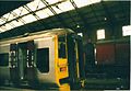 A Wessex Trains train in Bristol Temple Meads station with British Post Office wagons in the background during 2001