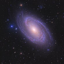 M81 with satellite galaxy Holmberg IX in the top center-right corner M81.jpg