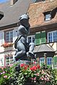 Putte auf dem Brunnen am Rathausplatz.