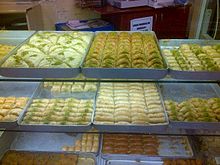 Some Turkish cuisine desserts like baklava, sobiyet, sutlu nuriye, kalburabasti, burma kadayif, kadayif dolma, and badem tatlisi Postres turcos.jpg