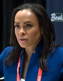 Headshot of Linsey Davis speaking during a book event. She is middle-aged black woman with dark hair wearing a blue morning suit.