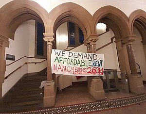 Hanging protest banner at the University of Manchester