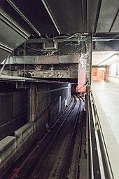 Tracks visibly curving around the terminal near a platform