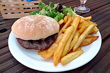 A hamburger with crispy fries Hamburger and fries - Grape and Grain, Crystal Palace, London.jpg