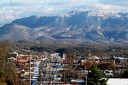 Seymour, with Chapman Highway on the left and Bluff Mountain in the distance; the towers sit on the summit, 2010