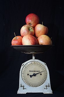 pile of apples on a kitchen scale
