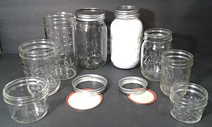 Two-piece lid mason jars. Wide-mouth style on the left and regular mouth to the right.