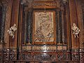 Angel Urges Flight to Egypt (1675) with busts of flanking donors, Ginnetti chapel, Sant'Andrea della Valle, Rome.