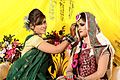 Image 37Relatives decorating the bride with traditional wedding turmeric in a Bangladeshi Gaye Holud ceremony in Dhaka. (from Culture of Bangladesh)