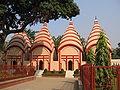 Image 50Dhakeshwari Temple is a famous state-owned Hindu temple in Dhaka, Bangladesh built in the 12th century. The temple is located southwest of the Salimullah Hall of Dhaka University. This image shows Shiva temple structures inside the Dhakeshwari Temple complex. Photo Credit: Ragib Hasan