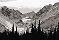 Alabaster Peak centered in back, looking though valley of Monument Creek