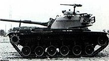 M60 production pilot number 1 after completion by Chrysler on 2 July 1959. Note the use of a pedestal mounted M2HB machine gun on the cupola. The turret is traversed to the rear of the tank. M60 Pilot 1.jpg