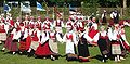 Women in traditional Saaremaa dress performing a folk dance