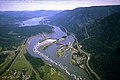 Aerial view of spillway flanked by powerhouses, Bonneville Lock (near right) and Lake