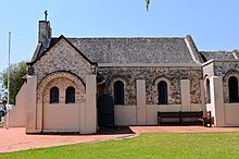 The church in 2010, with the porch and the 1980s-added piers, buttresses and rendering clearly visible