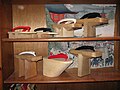 Top: Plain low (5 cm) geta with red straps, plain geta with black straps, tall/takai (10 cm) geta, one-tooth (14 cm) Tengu geta. Bottom: tall (18 cm) rain/ashida geta, Maiko's okobo (13 cm), tall (20 cm) Tengu geta.