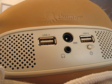 Close up of the rear of an original Chumby, showing the speakers, two USB ports, headphones jack, power button, and power port Chumby rear close-up.jpg