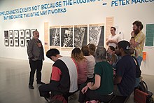 a group of students in an art gallery