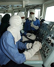 Pakistan Navy's sailors wearing anti-flash gear while operating a Guided missile frigate, PNS Alamgir