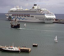 Santa Maria, Columbus' flagship, in front of the cruise ship AIDAblu