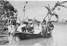 A photograph showing Swami Abhayananda of Bharat Sevashram Sangha distributing relief items from in Dalalbazar under Lakshmipur police station in Noakhali district. Dalalbazar falls under Lakshmipur district in present day Bangladesh.