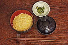 Tamago kake gohan (left), with tsukemono and miso soup Tamagokake-gohan.JPG