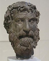 Bronze head of bearded man.