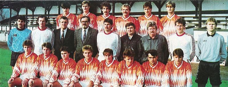 A dorogi csapat 1991 tavaszán. Felső sor balról: Szépvölgyi Zoltán, Mózner János, Szedlacsek István, Varga János, Harmat József, Schuttovics László. Középső sor: Bohner Zoltán, Honti József edző, technikai vezető, dr. Pák Gábor orvos, Matyók László társadalmi elnök, Reszeli Soós István vezetőedző, Wágner Ferenc szakosztályvezető, Csuha András elnök, Holdampf Sándor pályaedző, gyúró, Belányi István. Elöl: Csapó Károly, Tóth Ferenc, Guba Péter, Borsos Zsolt, Ignácz János, Szenczi Gábor, Romfa Károly és Marosvölgyi József