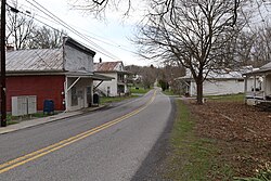 Sinks Grove in 2022, with the post office building at left