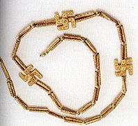 Golden necklace of three Swarga (Swastikas) from Marlik, kept at the National Museum, Tehran.