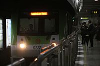 An AC08 train entering the station