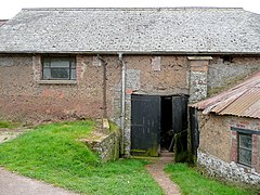 A rare wall material is Cob which is similar to adobe. Devon, England.