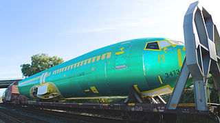 Boeing 737 Next Generation fuselage being transported by rail on a flatcar