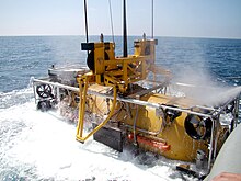 The pressurized rescue module (PRM) is recovered from the water after performing a submarine rescue exercise. Pressurized rescue module.jpg