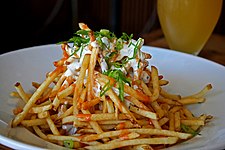 Shoestring fries, garlic, homemade blue cheese dressing, with some spicy sauce.jpg