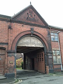 Entry to Middleport Pottery, a large brick arch bearing the name