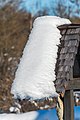 English: Snow on the edge of a wooden roof at the cemetery Deutsch: Schnee am Ende eines Daches am Friedhof