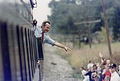 President Bush waving from the train outside Bowling Green during his whistle-stop campaign