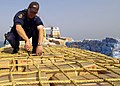 Image 85A sailor from HMAS Adelaide inspecting a ship in the Persian Gulf during 2004 (from History of the Royal Australian Navy)